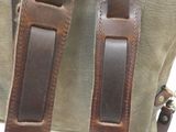 a brown bag with a brown strap on it