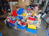 a pile of boxes and boxes on a pallet in a warehouse