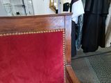 a red chair that is sitting in a room