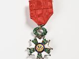 a medal with a star on it on a white surface