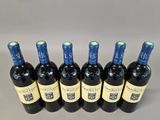 six bottles of red wine are lined up in a row