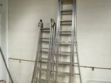 many ladders that are sitting in a room
