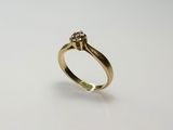 an image of a gold ring with a diamond on it