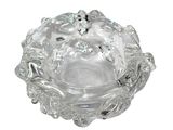 a clear glass bowl with a flower design on it