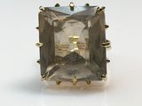 a close up of a ring with a stone in the middle