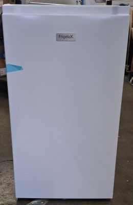 an image of a white refrigerator in a warehouse