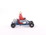 a small toy car with a person riding on it