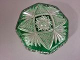 a green glass box that has a star design on it