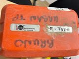 an orange case with writing on it sitting on a table
