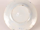 a white plate with a blue and white design on it