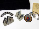 a lot of patches and a bag on the table