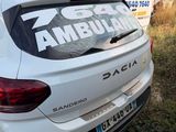 a white car that has a sticker on the back of it