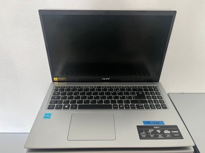 an open laptop computer sitting on top of a table