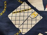 a close up of a bag with chains on it