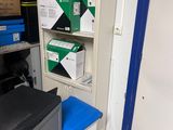 many boxes and boxes on the shelves in the room