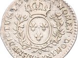 a close up of a coin with a crown on top of it