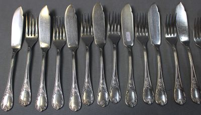 a lot of forks and spoons that are on the table