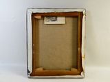 a close up of a picture frame with a piece of paper in it