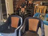 two plastic chairs that are sitting in a room