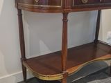 a wooden table with a shelf on top of it