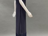 an image of a mannequin wearing a black dress with fringes