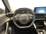 the interior of a car with a steering wheel, dashboard, and touch screen