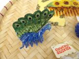 a plate with a green and blue frog on it