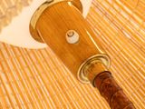 a close up view of a bamboo umbrella with a wooden handle