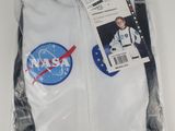 the shirt is white and has a nasa patch on it