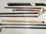 many different types of canes on display on the table