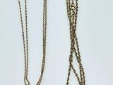 three different types of necklaces on a white surface