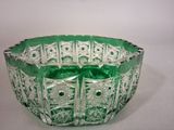 an image of a green glass bowl sitting on top of a table