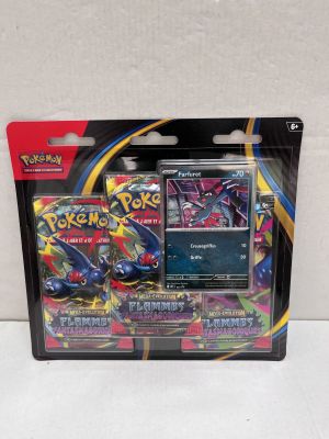 a close up of a box of pokemon cards on a white surface