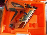 an orange box with a stapler and a stapler in it
