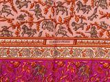 an image of a close up of a pink and orange sari