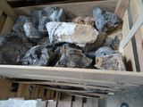 a wooden box filled with rocks and wood planks