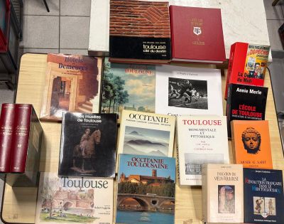 many books that are on the table together