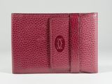 the red leather wallet is open and ready to be used