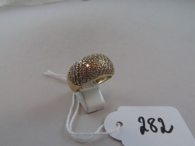 a ring that is sitting on a table with a price tag