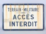 an image of a sign that says terrain miltiare access interdit