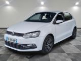 a white volkswagen polo estate parked on a checkered floor