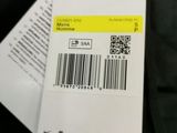 the back of a black jacket with a barcode on it