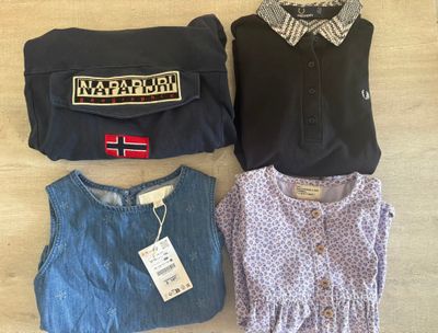 three pieces of clothing are laid out on a table