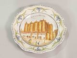 a plate with a picture of a castle on it
