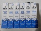 quatre boîtes de crème pour les yeux Marmaly posées sur une table