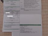 a picture of a receipt on a table next to a cell phone