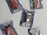 four packets of chocolate sitting on top of a white table