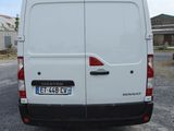a white van that is parked in a parking lot