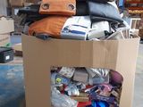 a cardboard box filled with lots of items in a warehouse