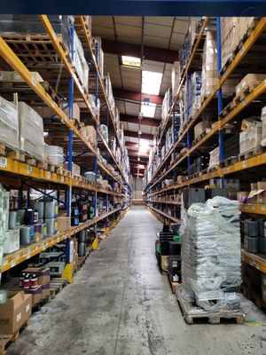 a large warehouse filled with lots of boxes and pallets